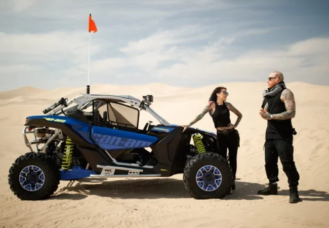 2 Seater Can-Am Maverick X3 RS Turbo RR dune buggy in Lahbab red dunes Dubai - Desert Buggy Rental Dubai