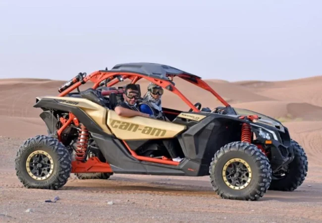 2 Seater Can-Am Maverick X3 dune buggy in Lahbab red dunes Dubai - Desert Buggy Rental Dubai