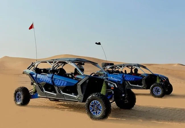 4 Seater Can-Am Maverick X3 RS Turbo RR dune buggy in Lahbab red dunes Dubai - Desert Buggy Rental Dubai