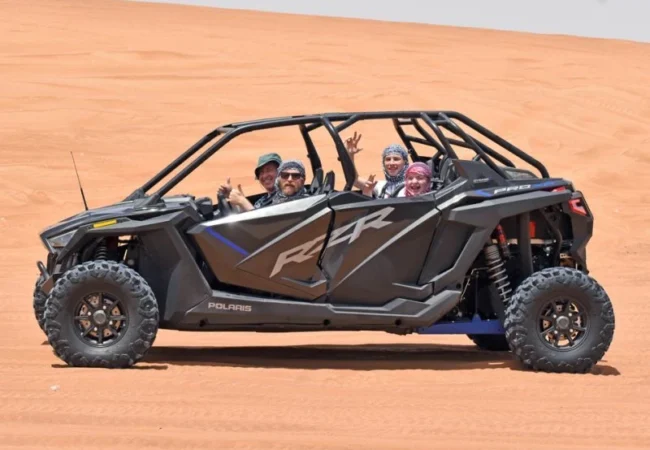 4 Seater Polaris RZR 1000cc Turbo dune buggy in Lahbab red dunes Dubai - Desert Buggy Rental Dubai