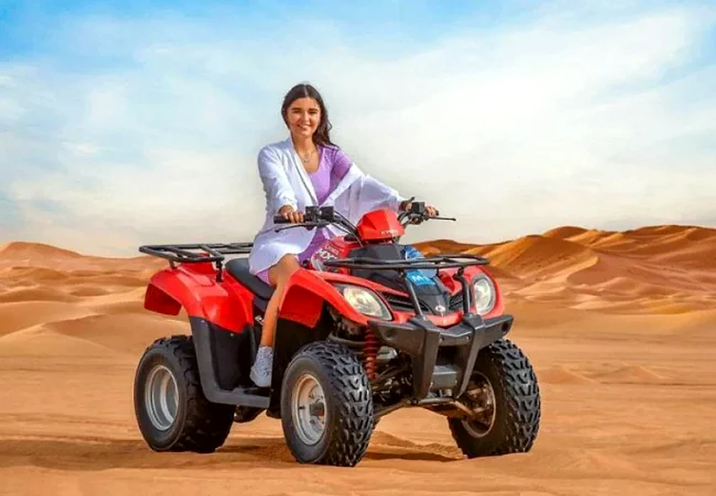 Kymco single seater quad bike in the open deep desert near Dubai - Desert Buggy Rental Dubai