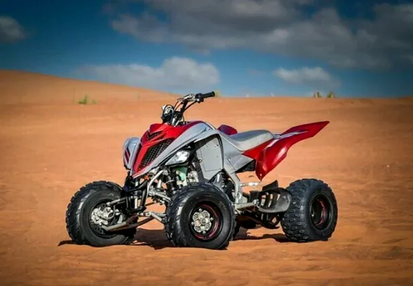 Yamaha Raptor 700cc manual single seater quad bike in deep desert Dubai - Desert Buggy Rental Dubai