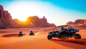 Tourists riding quad bikes and dune buggies across the red desert dunes of Wadi Rum, Jordan, at sunset