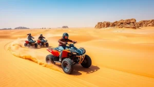 Tourists riding quad bikes across the golden sand dunes of Khor Al Adaid in Qatar with the Inland Sea in the background at sunset