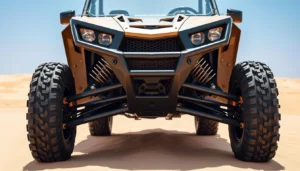 Front view of a 2-seater dune buggy in Dubai desert showing headlights, suspension and chunky off-road tires