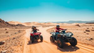 Tourists riding quad bikes across the rugged terrain of the Tabernas Desert in Andalusia, Spain, with mountains in the background
