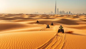 ATV riders crossing rippled sand dunes with the Dubai skyline and a tall tower on the horizon