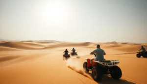Riders on quad bikes heading across hazy desert dunes, with a man in a grey shirt in front, desert quad biking in Dubai