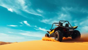 Yellow and black dune buggy climbing a sand dune and kicking up sand under a bright blue sky in Dubai