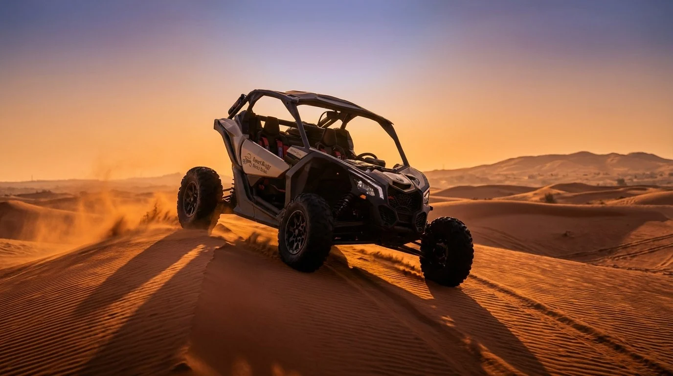 Tourists driving dune buggies in a convoy across the red dunes of Ras Al Khaimah desert at sunset, with a guide leading the way
