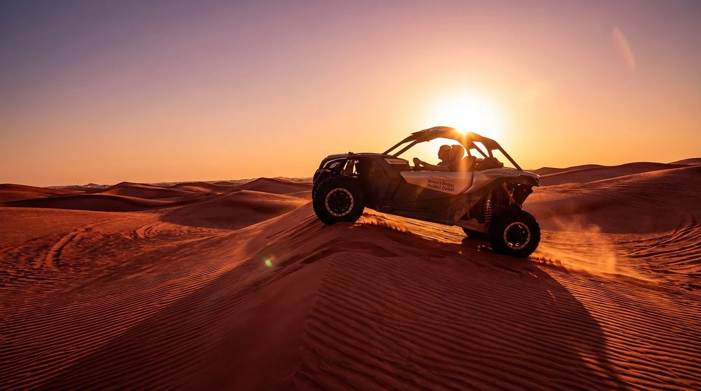 Tourists riding dune buggies across red Dubai dunes at sunset, enjoying a thrilling desert safari experience