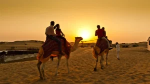 Tourists enjoying a thrilling dune bashing experience in a 4x4 vehicle during a morning desert safari in Dubai