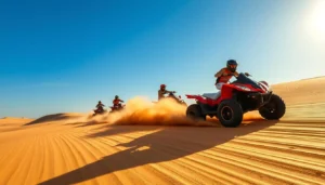 Rider on a red quad bike leading a group across sunlit desert dunes during quad biking in Dubai