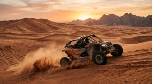Self-drive dune buggy on golden Ras Al Khaimah desert dunes at sunset before a guided tour