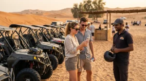 Couple confirming a secure desert buggy rental booking on a phone beside self-drive buggies
